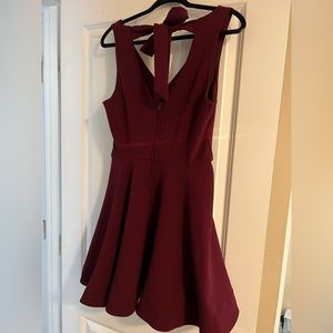 Maroon dress, flattering for all sizes. Flairs on bottom and has a high waist.
